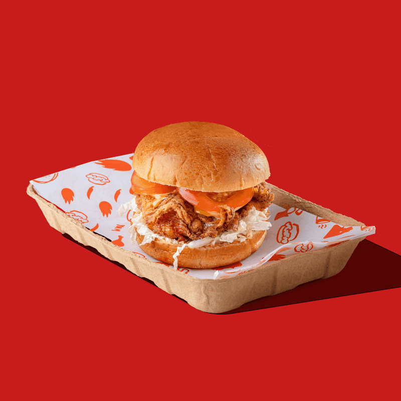 A crispy chicken burger with fresh toppings